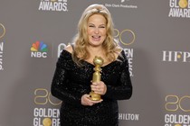 Jennifer Coolidge poses with the award for Best Supporting Actress in television at the Golden Globes.