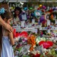 Child in front of flower memorial