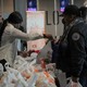 TSA workers line up at a food bank.