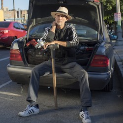 Charlie Santore sits on his trunk full of safecracking equipment