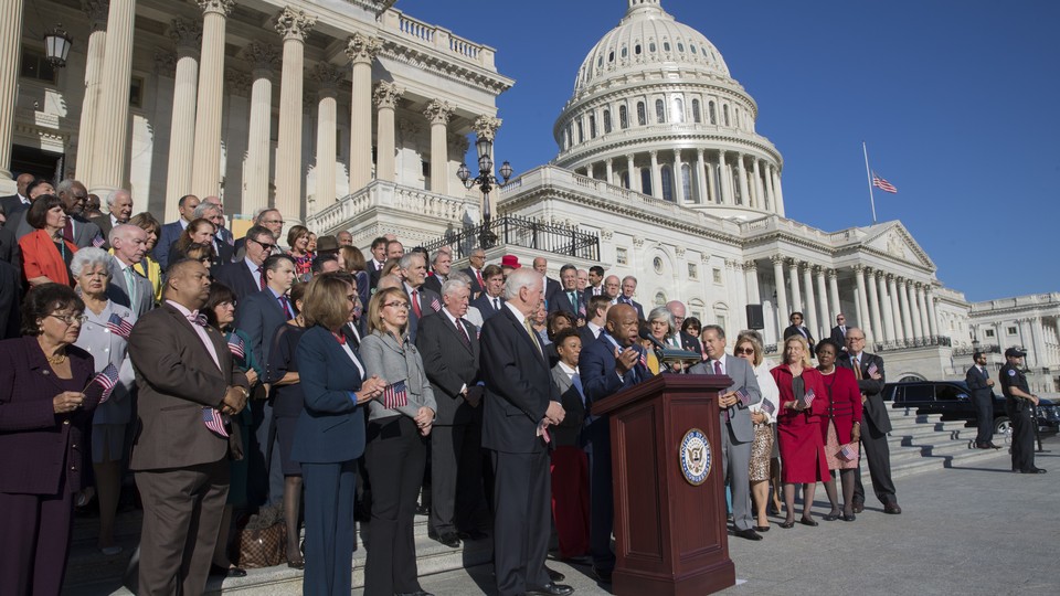 Dozens of members of Congress gather outside the Capitol building in Washington, D.C., for a press conference