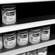 Store shelves of infant formula, half-empty
