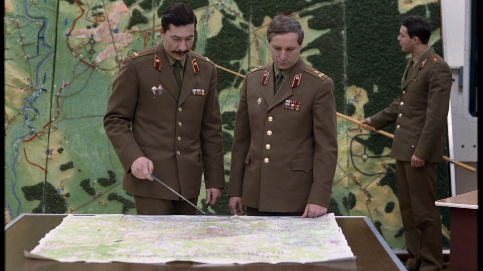 Russian officers looking at a map