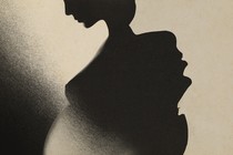 A pregnant person's silhouette