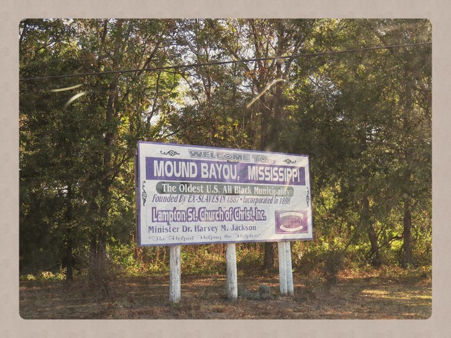 A billboard on the side of the road