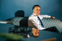 A photograph of Mitt Romney in his senate office.