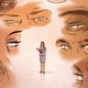 An illustration of a woman surrounded by staring eyes