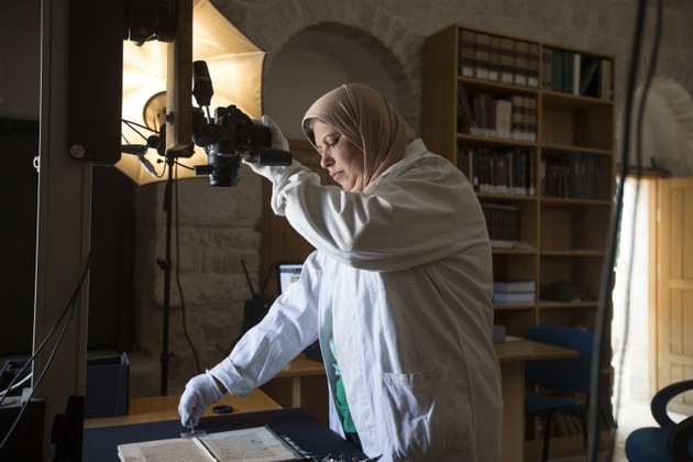 Technician Shaima Budeiry digitizes a manuscript in Jerusalem (Matilde Gattoni)
