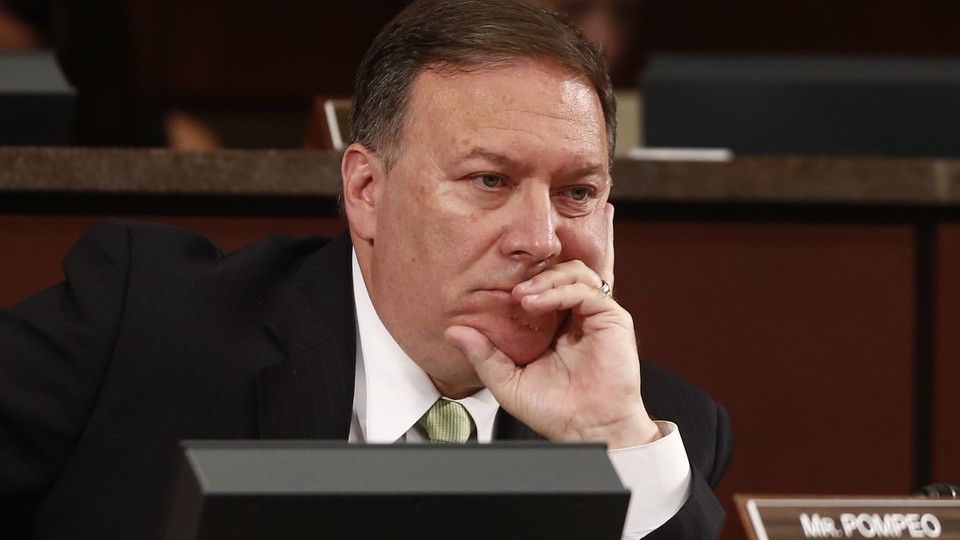 Mike Pompeo listens to testimonies before the House Permanent Select Committee on Intelligence in 2013.