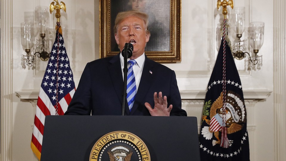 President Trump speaking at a podium