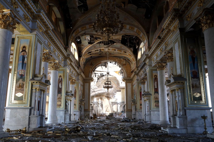 The interior of a bomb-damaged cathedral, with debris scattered across the floor