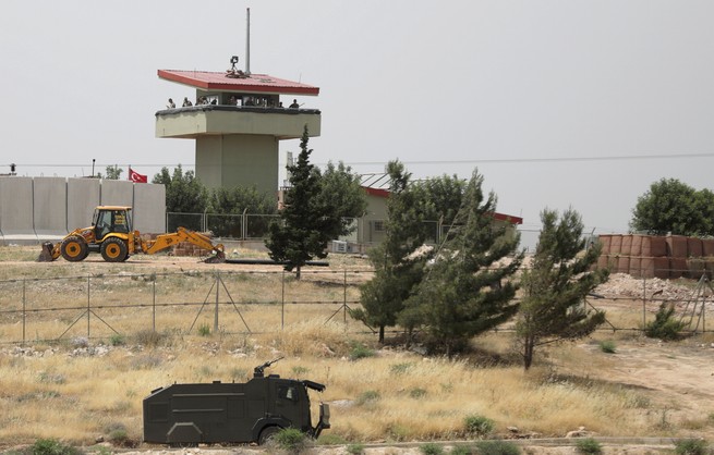 A Turkish military watchtower stands at a crossing on the Syrian-Turkish border.