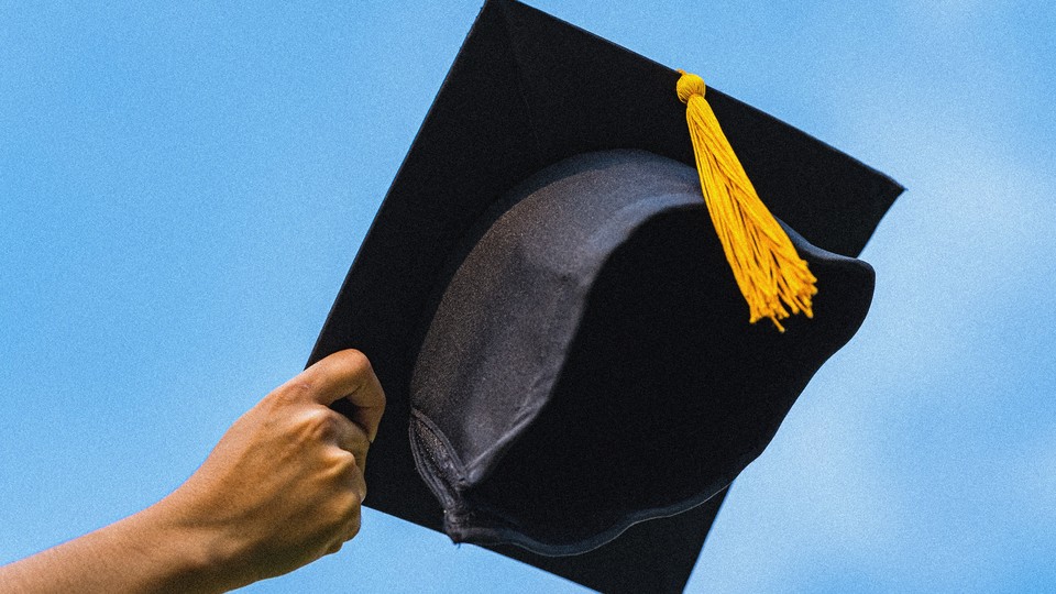 Photograph of a hand reaching out from the bottom left corner holding a mortarboard, as if it's about to be thrown