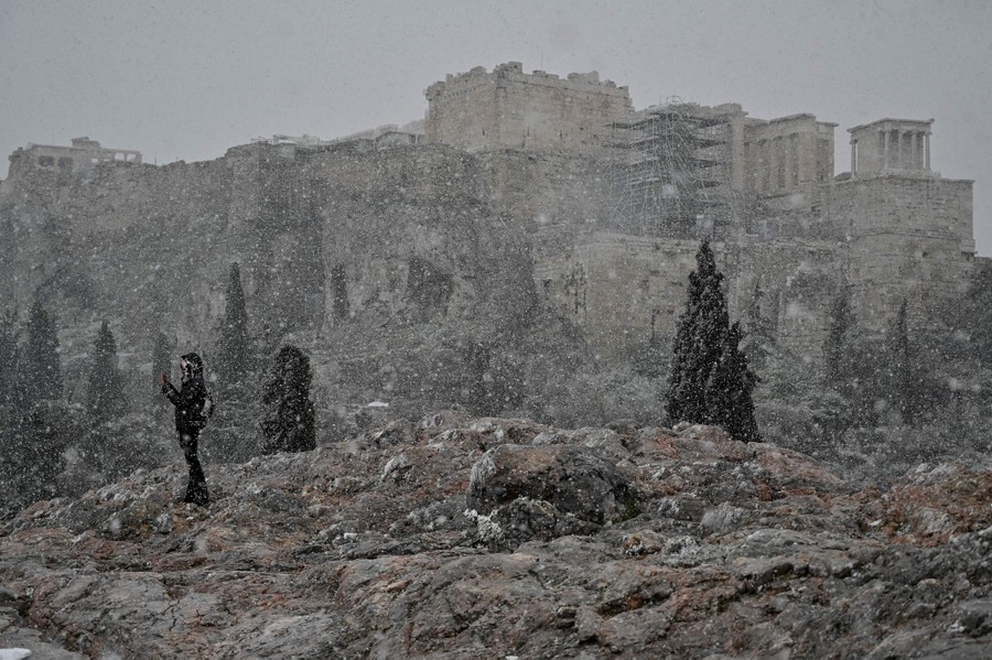 Snow falls over Athens, Greece.