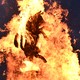 A figure of a bull is burned atop a bonfire.