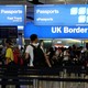 Travelers line up at the U.K. border control at Heathrow Airport in London on July 30, 2017. 