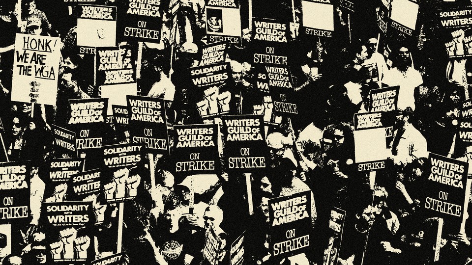 Black-and-white photo showing crowded protest. Many signs read "Writers Guild of America on Strike."