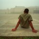 A boy sits in an outdoor recreation area at the Liberty County Jail in Texas.