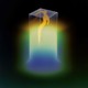 A yellow figure floats up to the top of a glass box surrounded by color and darkness.