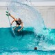 A surfer in a wave pool in Waco, Texas