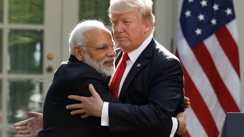 India's Prime Minister Narendra Modi hugs U.S. President Donald Trump as they give joint statements in the Rose Garden of the White House in Washington, D.C., June 26, 2017