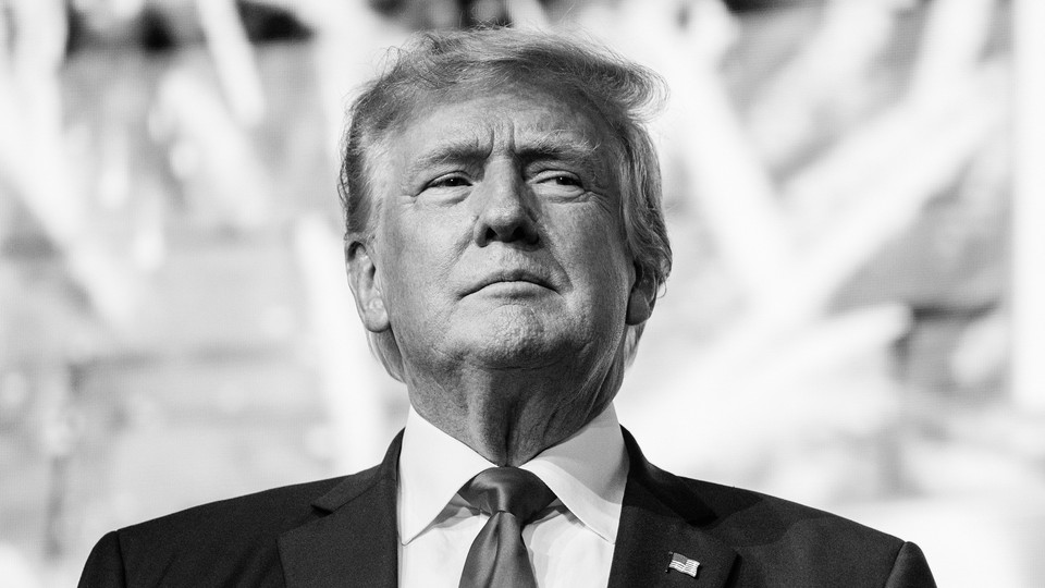 A black and white photo of Donald Trump