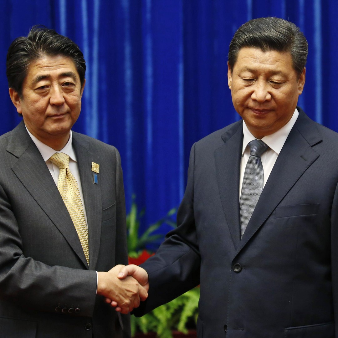 China's Xi Jinping's Handshake With Japan's Shinzo Abe Was