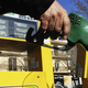 An image of a person holding a gas pump.