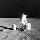 Buzz Aldrin moves equipment on the moon.