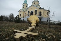 A damaged dome in the yard of an Orthodox church damaged by shelling in Donetsk, eastern Ukraine, in 2014