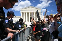 US Supreme Court Police officers put up barricades to separate anti-abortion activists from aborton rights activists during a demonstration in front of the Supreme Court