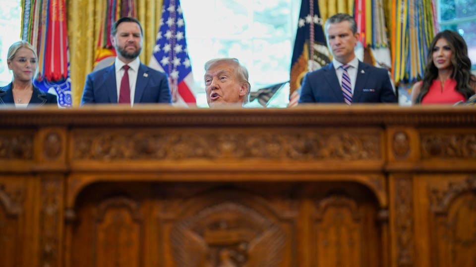 Donald Trump speaks from his desk in the Oval Office.