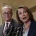 Senate Minority Leader Chuck Schumer and House Minority Leader Nancy Pelosi with microphones