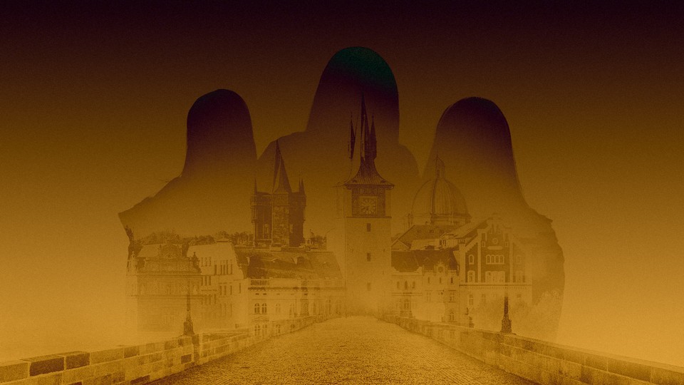 silhouette of three figures against a prague skyline