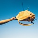 A yellow backpack swinging in the sky
