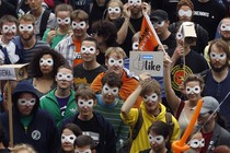 Protestors wearing masks at a rally for digital privacy in Berlin