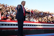 Trump shouts at a rally in front of a crowd