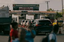 As commuters navigate through the Mandela/Eccles Roundabout, a sign that reads ESSEQUIBO BELONGS TO GUYANA greets commuters on the newly created portion of highway on the East Bank Demerara River, Georgetown, Guyana, on Thursday, Jan. 25, 2024.