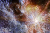 A bright young star within a colorful cloud-like nebula. The star is the brightest spot, dominating the right side of the image, surrounded by six large spokes of light that cross the image.