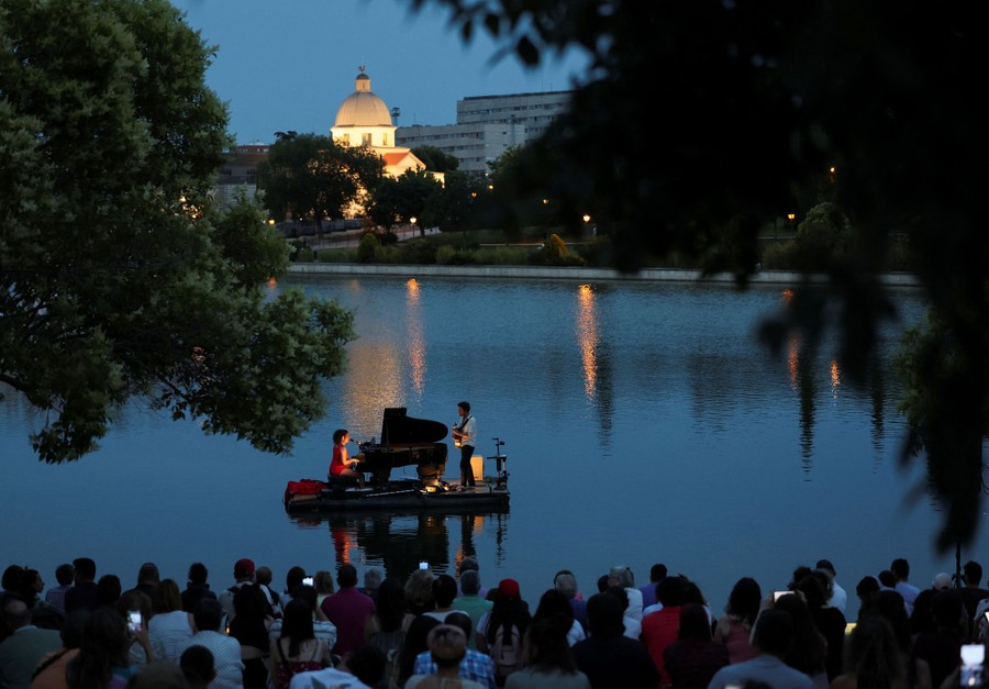 Photos of the Week Mormon Crickets, Dragon Boats, Floating Concert