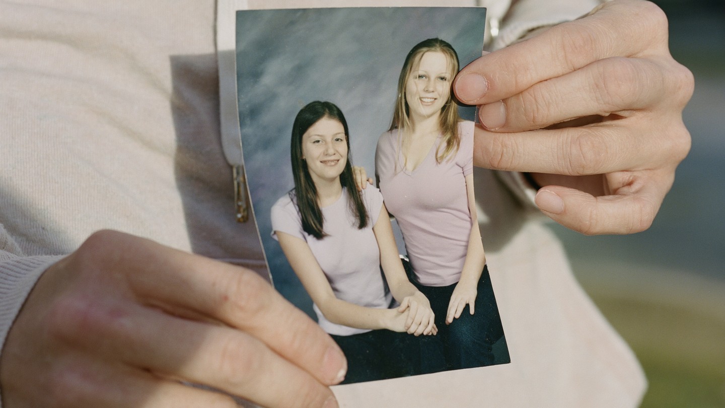 Bobbie Lynn Hodges holds a photo of herself with her best friend, Lavender Doe.