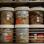 Human brains stored in jars filled with formaldehyde on shelves
