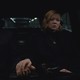 Shiv and Tom from "Succession" sitting in the back of a car in a scene from the show's finale