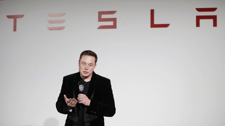 Elon Musk gives a presentation at Tesla