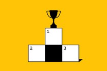 A crossword puzzle with a trophy on top