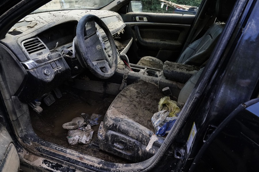 A view of the interior of a car covered in drying mud