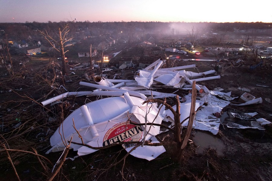 Wreckage of a destroyed water tower lies among other storm debris.