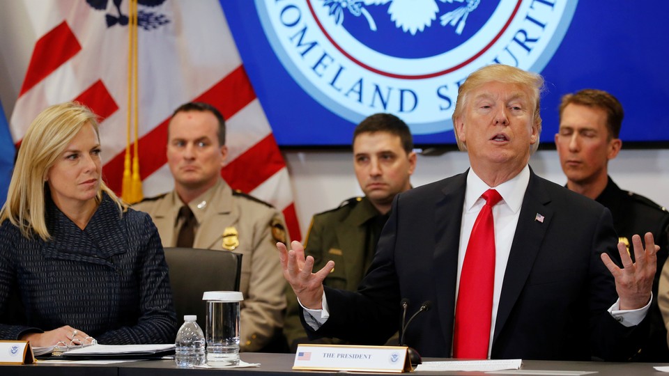 Donald Trump and Homeland Security Secretary Kirstjen Nielsen speak at a meeting in February.