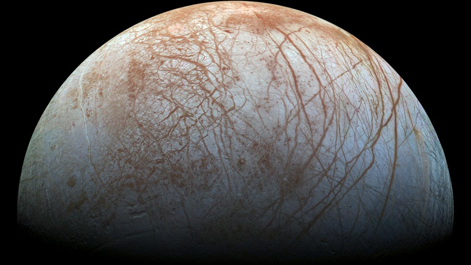 The criss-crossed, icy surface of Europa