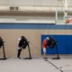 Voters casting their ballots in a gymnasium